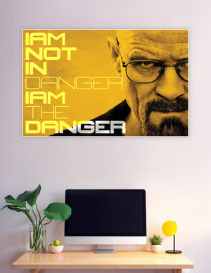 Breaking Bad poster featuring Walter White with bold yellow typography reading 'I Am Not In Danger, I Am The Danger' on a golden background