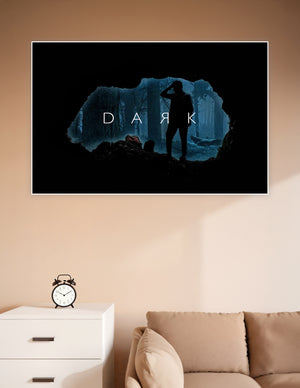 Silhouette of a person standing at a cave entrance overlooking a misty blue forest with the word DARK displayed, inspired by the Netflix series