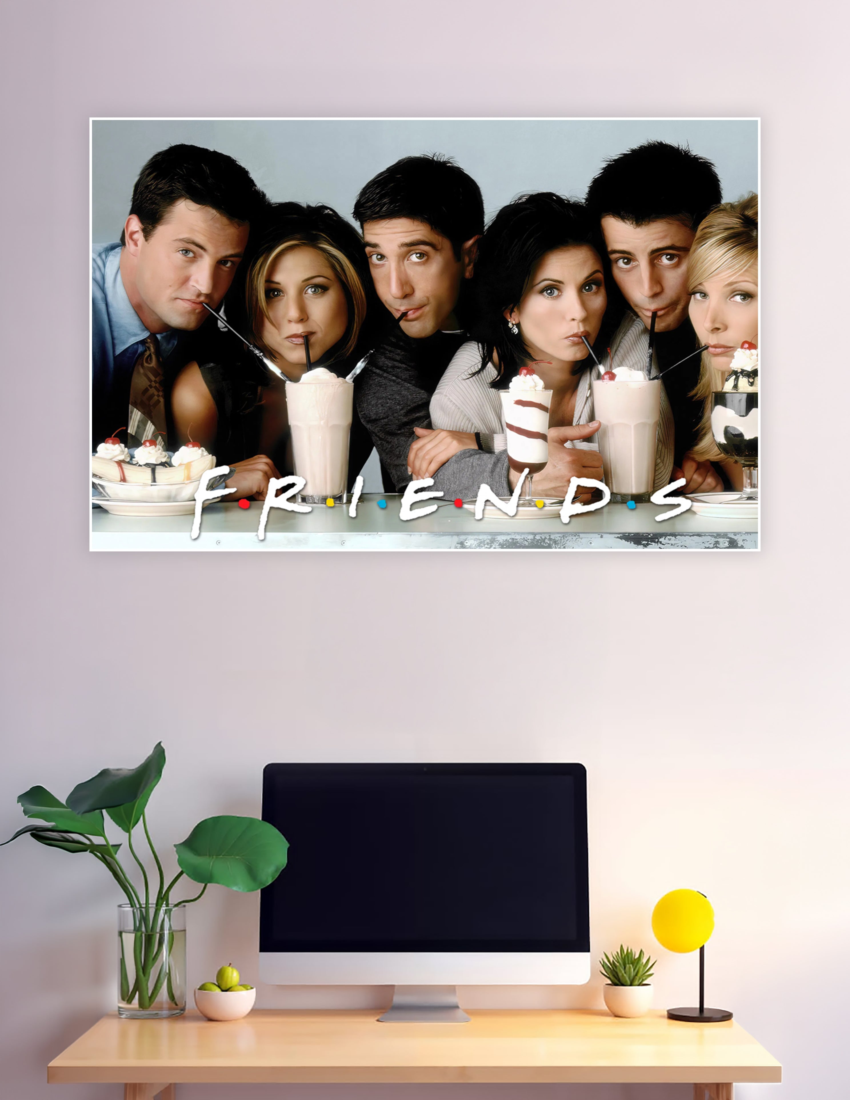 Friends TV show promotional poster featuring all six cast members sipping milkshakes with the Friends logo displayed at the bottom