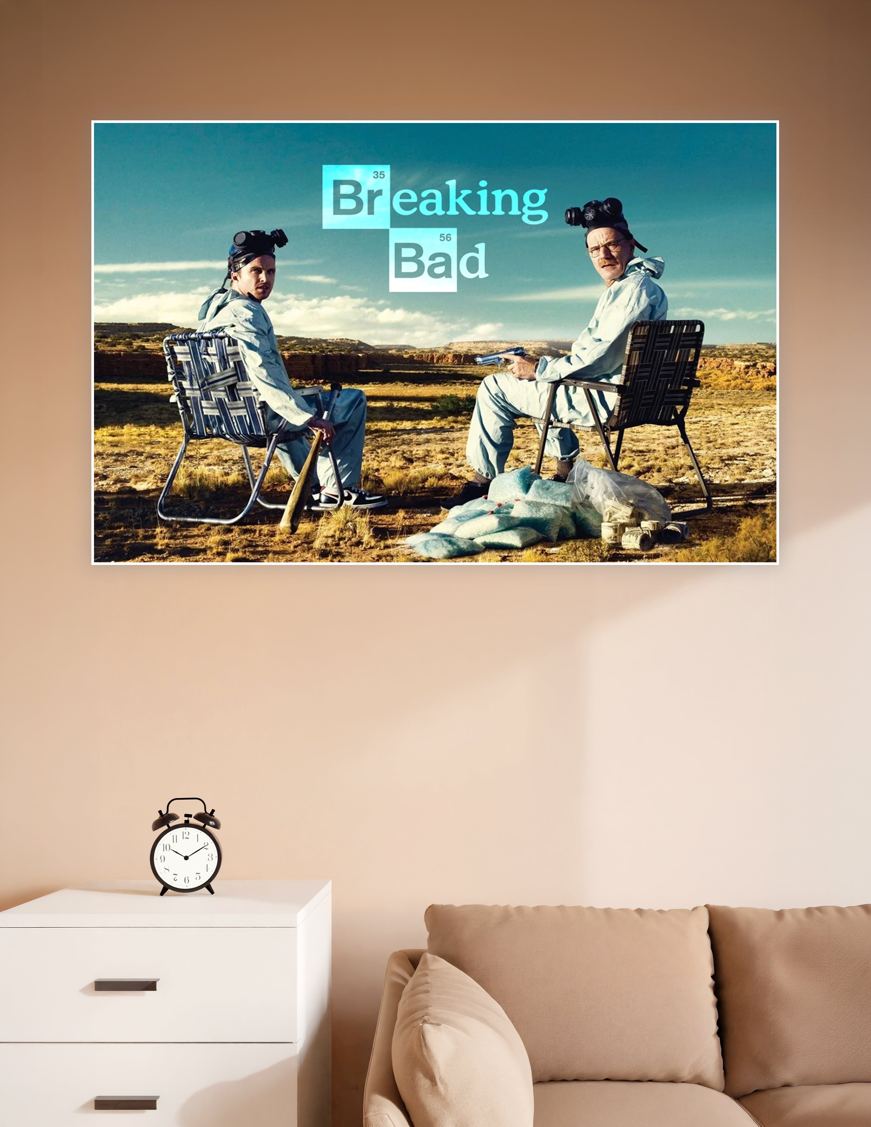 Breaking Bad poster showing Walter White and Jesse Pinkman in hazmat suits sitting in folding chairs in the New Mexico desert with the show's logo above them