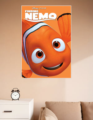 Disney Pixar Finding Nemo official movie poster featuring a close-up of Nemo the clownfish smiling on a bright orange background