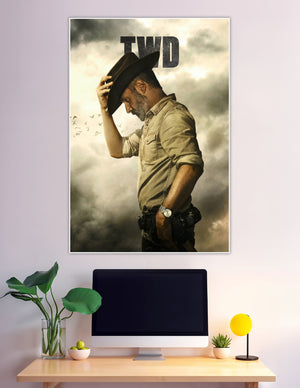 TWD promotional poster of Rick Grimes in side profile tipping his cowboy hat against a dramatic stormy sky with birds flying in the background