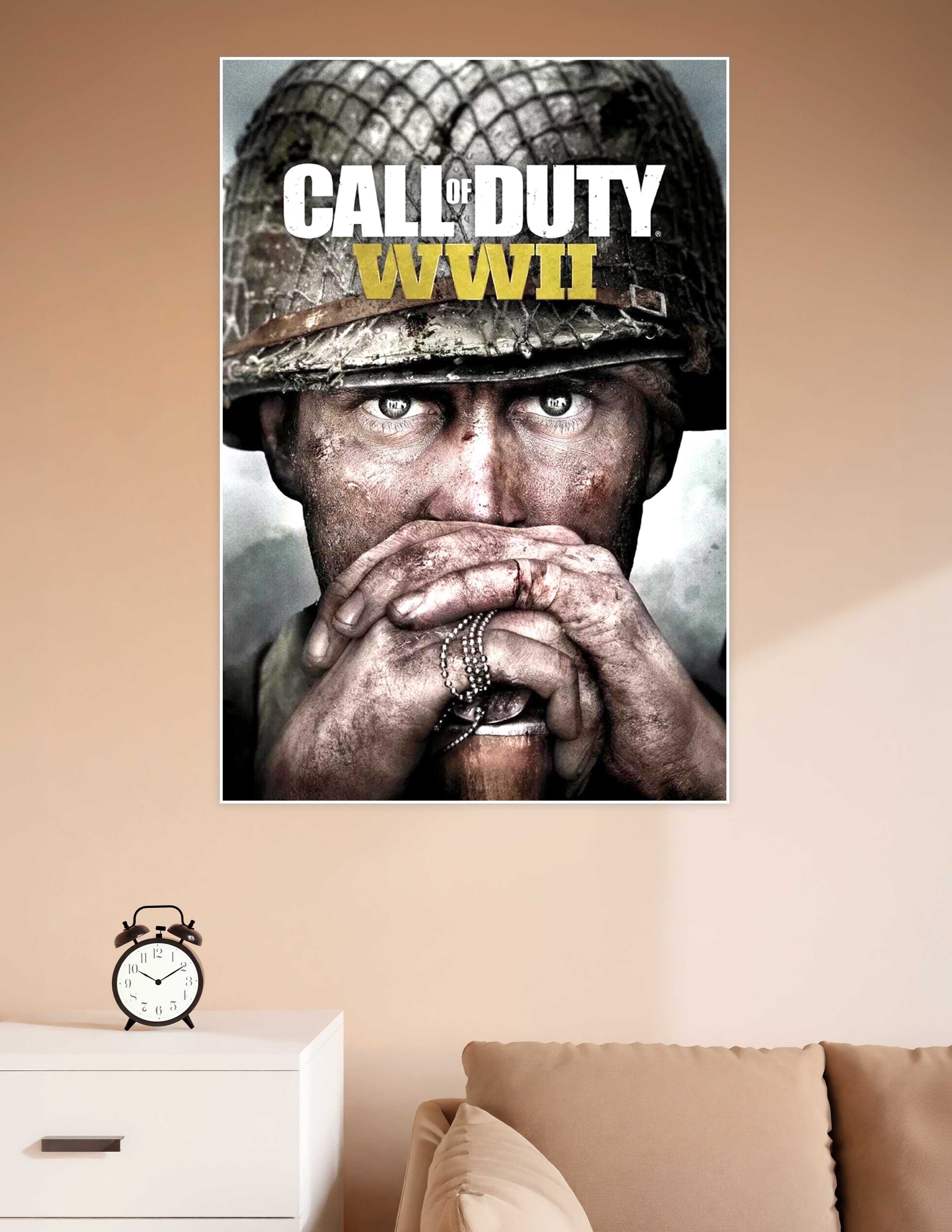 Call of Duty WWII official game cover poster featuring a battle-worn soldier clutching dog tags with intense eyes under a military helmet
