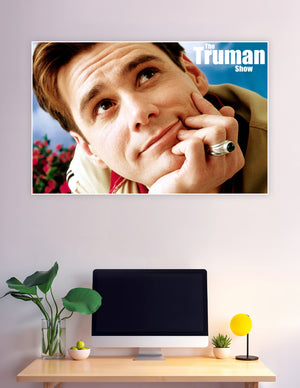 The Truman Show movie poster featuring a close-up of Truman Burbank with a curious expression against a bright blue sky