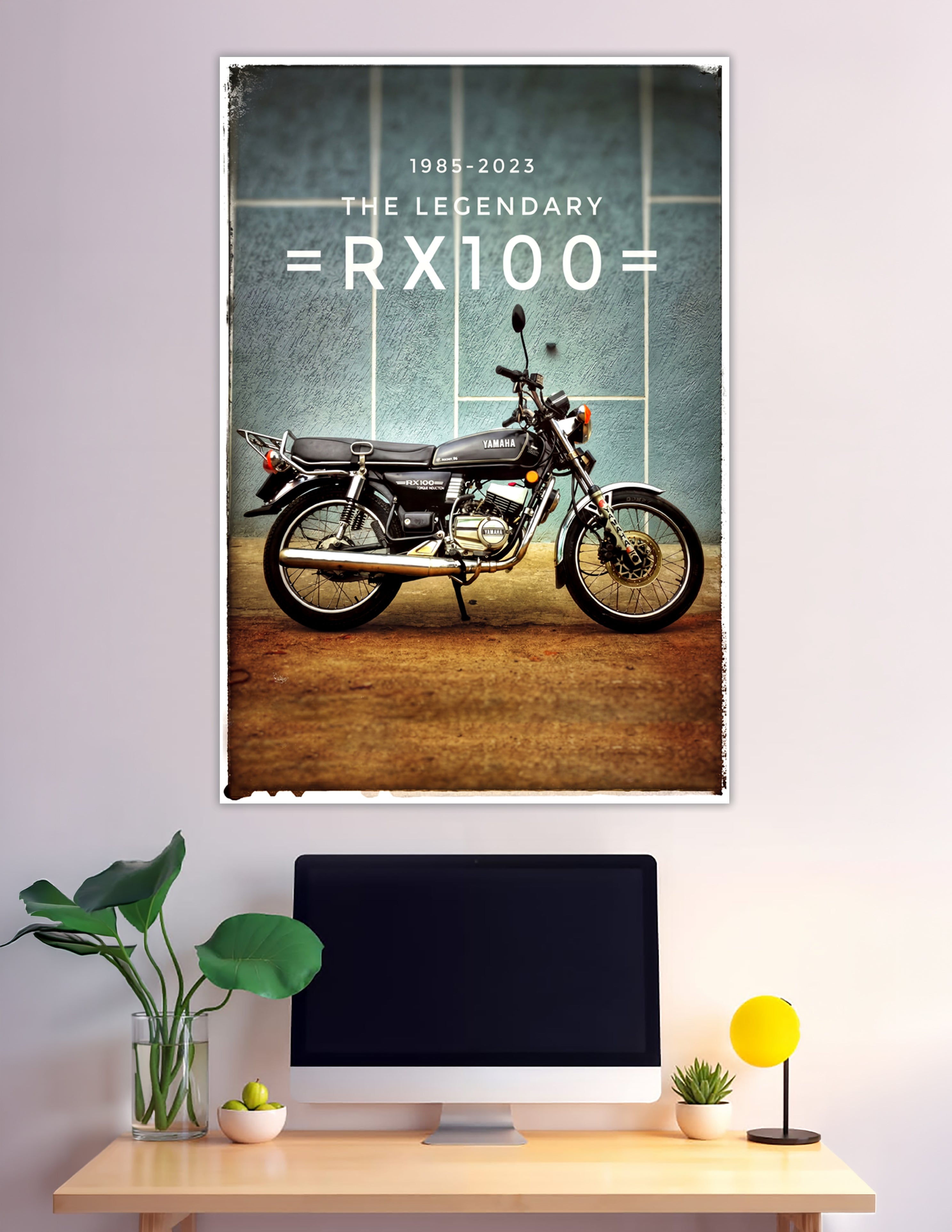 Vintage-style poster of the legendary Yamaha RX100 motorcycle in black, parked against a teal wall, with text reading 1985–2023 The Legendary RX100