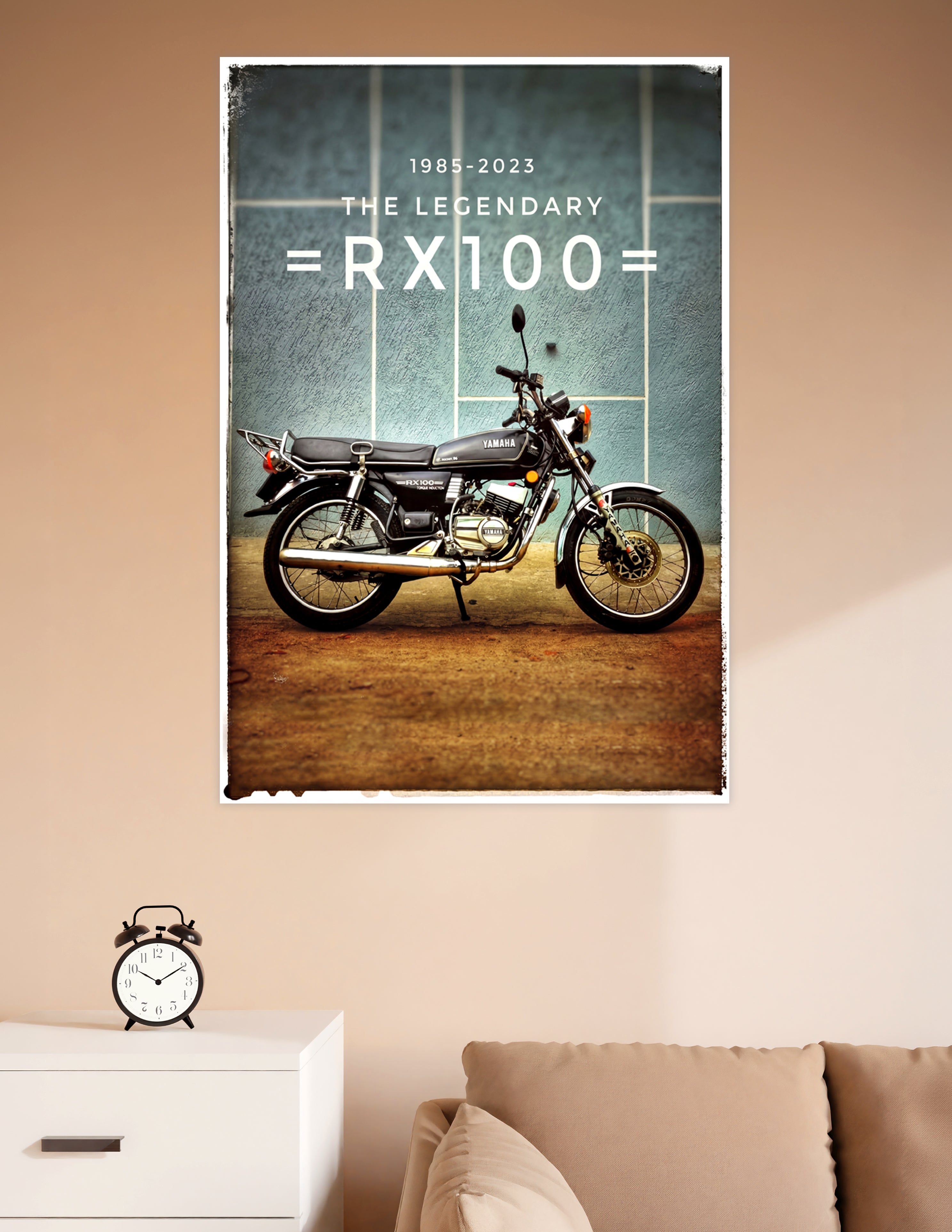 Vintage-style poster of the legendary Yamaha RX100 motorcycle in black, parked against a teal wall, with text reading 1985–2023 The Legendary RX100