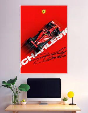 Top-down view of Charles Leclerc's red Scuderia Ferrari Formula 1 car with motion blur, bold CHARLES16 typography, Ferrari logo, and Leclerc's signature on a red background