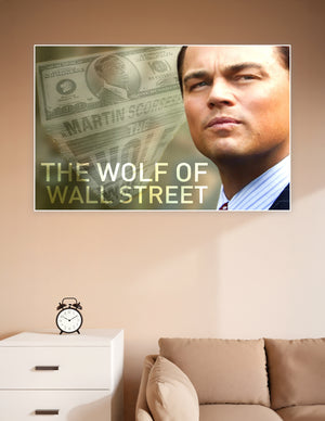 Wolf of Wall Street movie poster featuring dramatic male portrait with layered currency imagery and bold gold title typography by Martin Scorsese