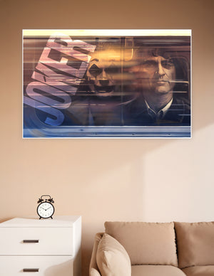 Cinematic poster of a man on a train with his Joker clown reflection visible in the window, overlaid with bold distressed typography in warm amber tones