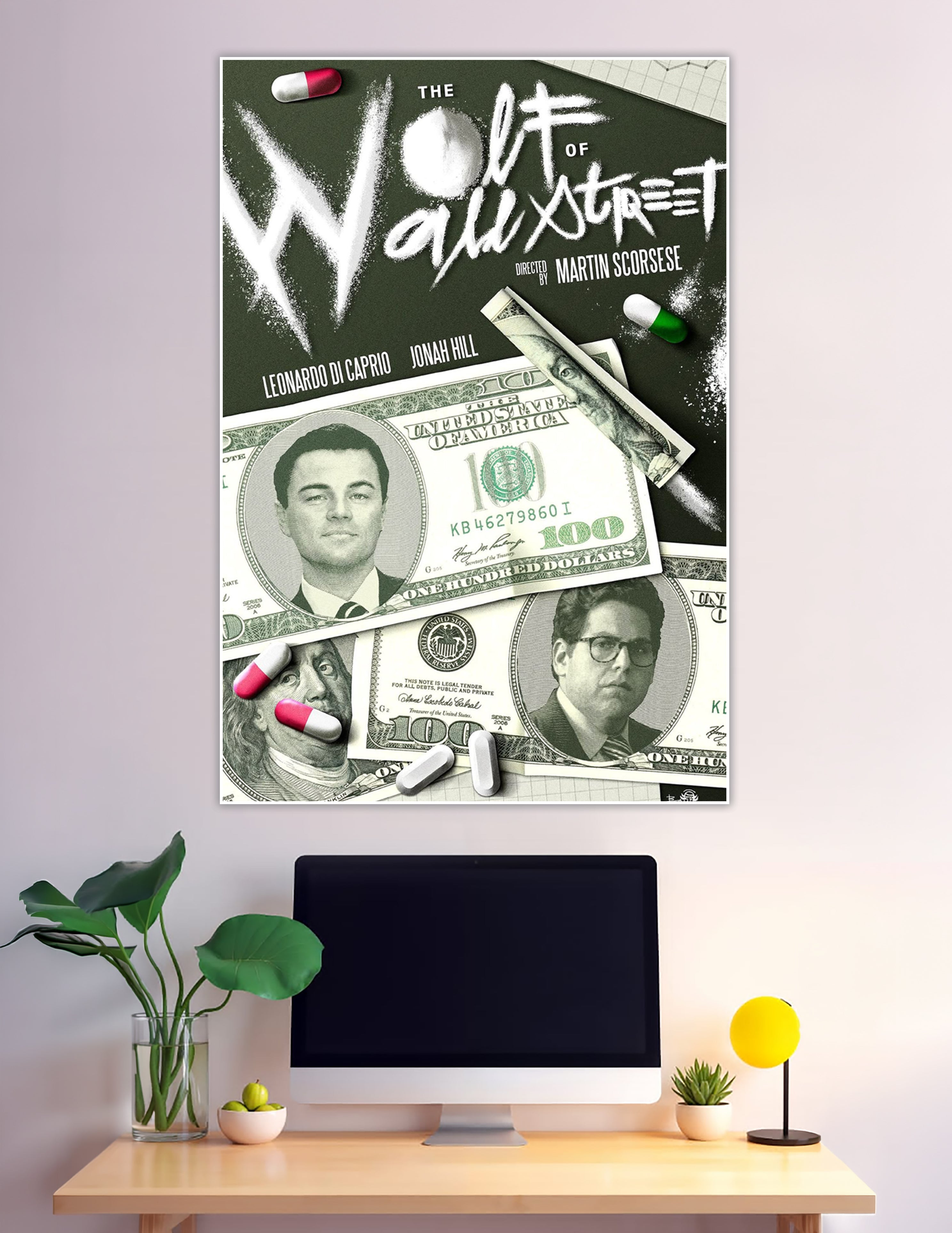 The Wolf of Wall Street movie poster directed by Martin Scorsese featuring Leonardo DiCaprio and Jonah Hill on hundred-dollar bills with white powder title typography on dark green background