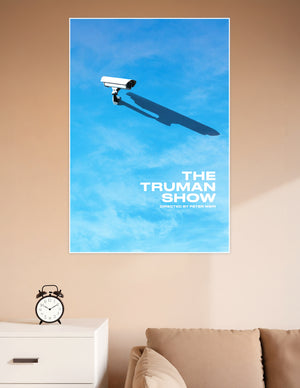 Minimalist Truman Show movie poster showing a surveillance camera casting a human-shaped shadow against a bright blue sky, directed by Peter Weir