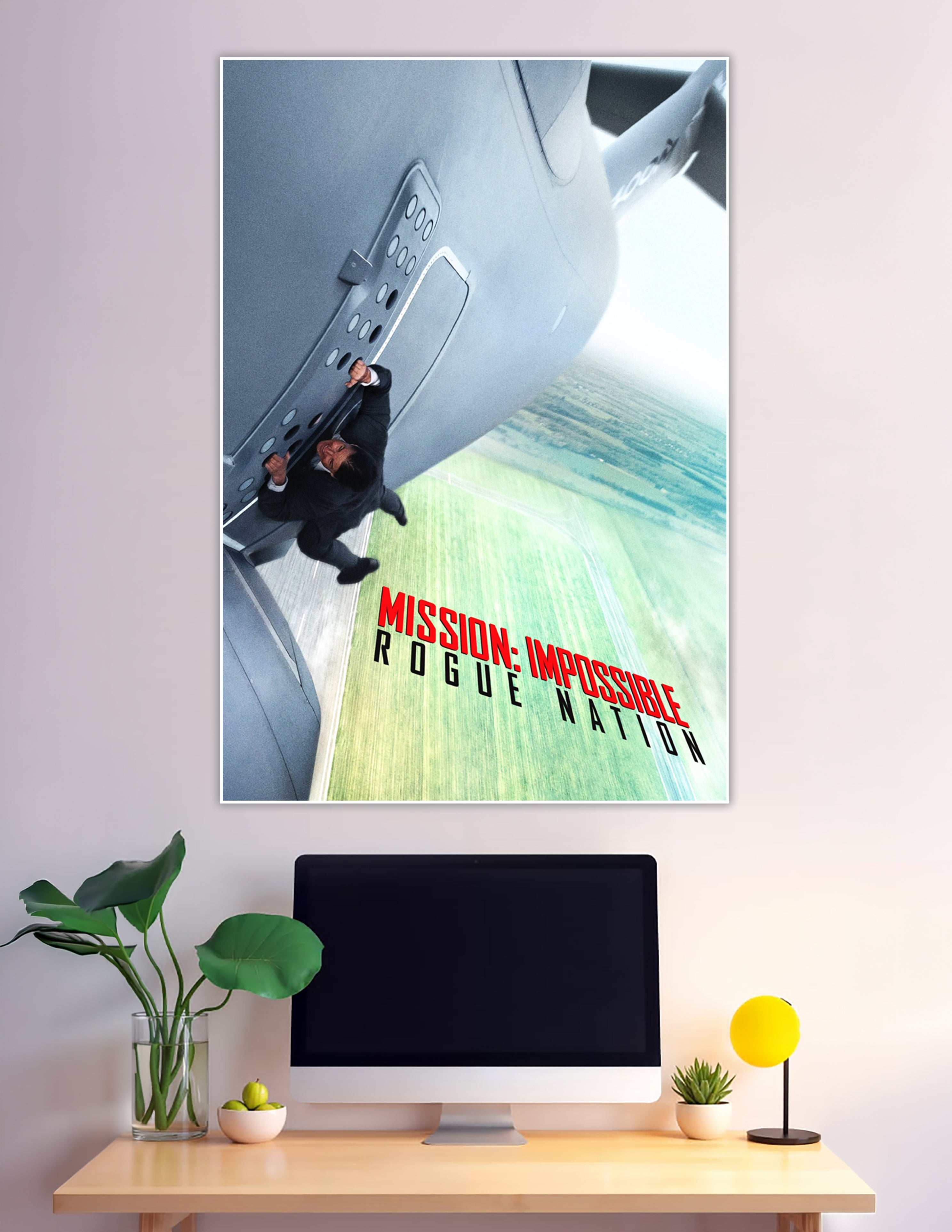 Mission Impossible Rogue Nation movie poster showing a man clinging to the door of a large aircraft in flight with bold red and black title text