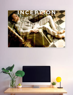Inception movie poster featuring a man in a suit reclining in a surreal double-exposure dreamscape with a checkered floor and the word INCEPTION above