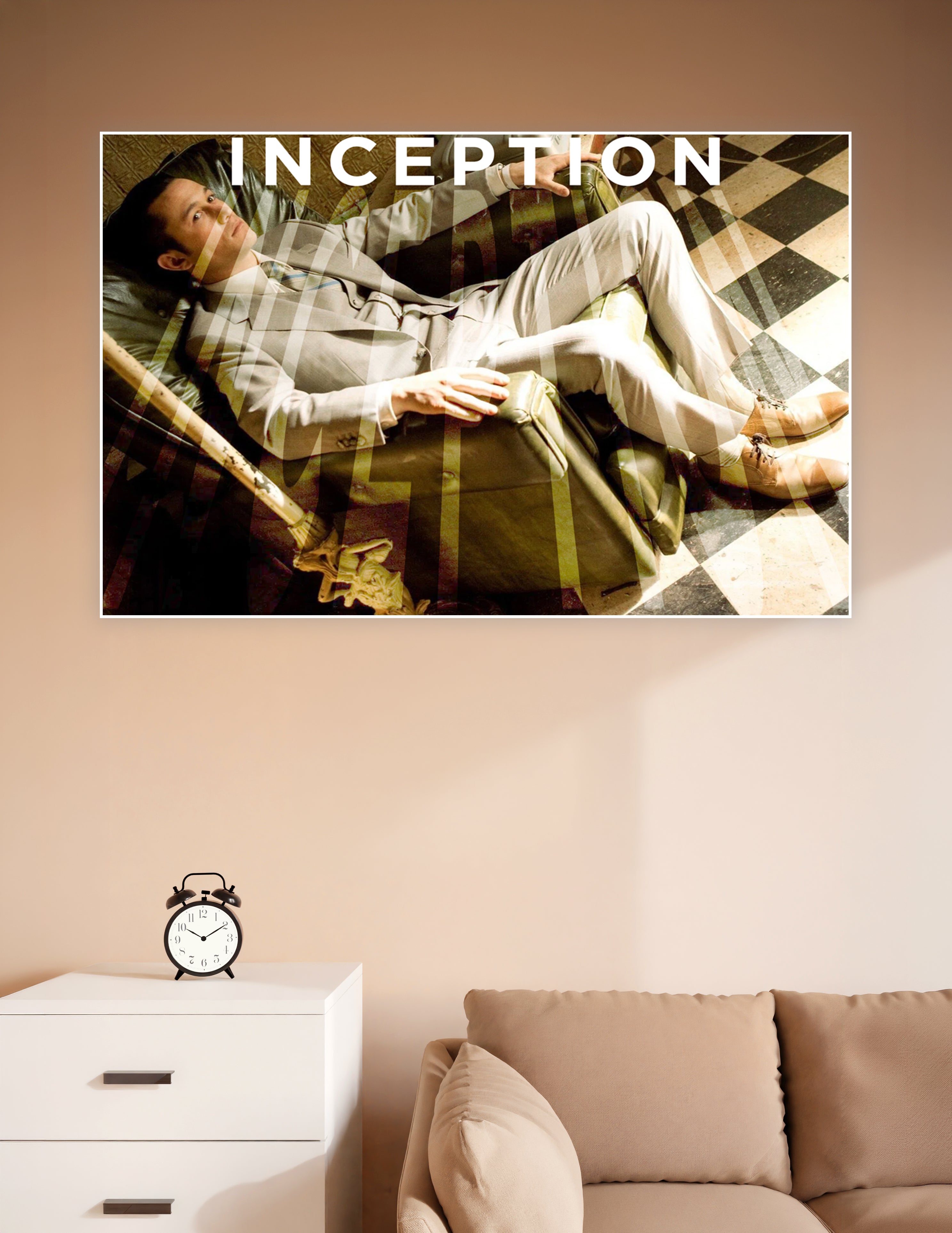 Inception movie poster featuring a man in a suit reclining in a surreal double-exposure dreamscape with a checkered floor and the word INCEPTION above