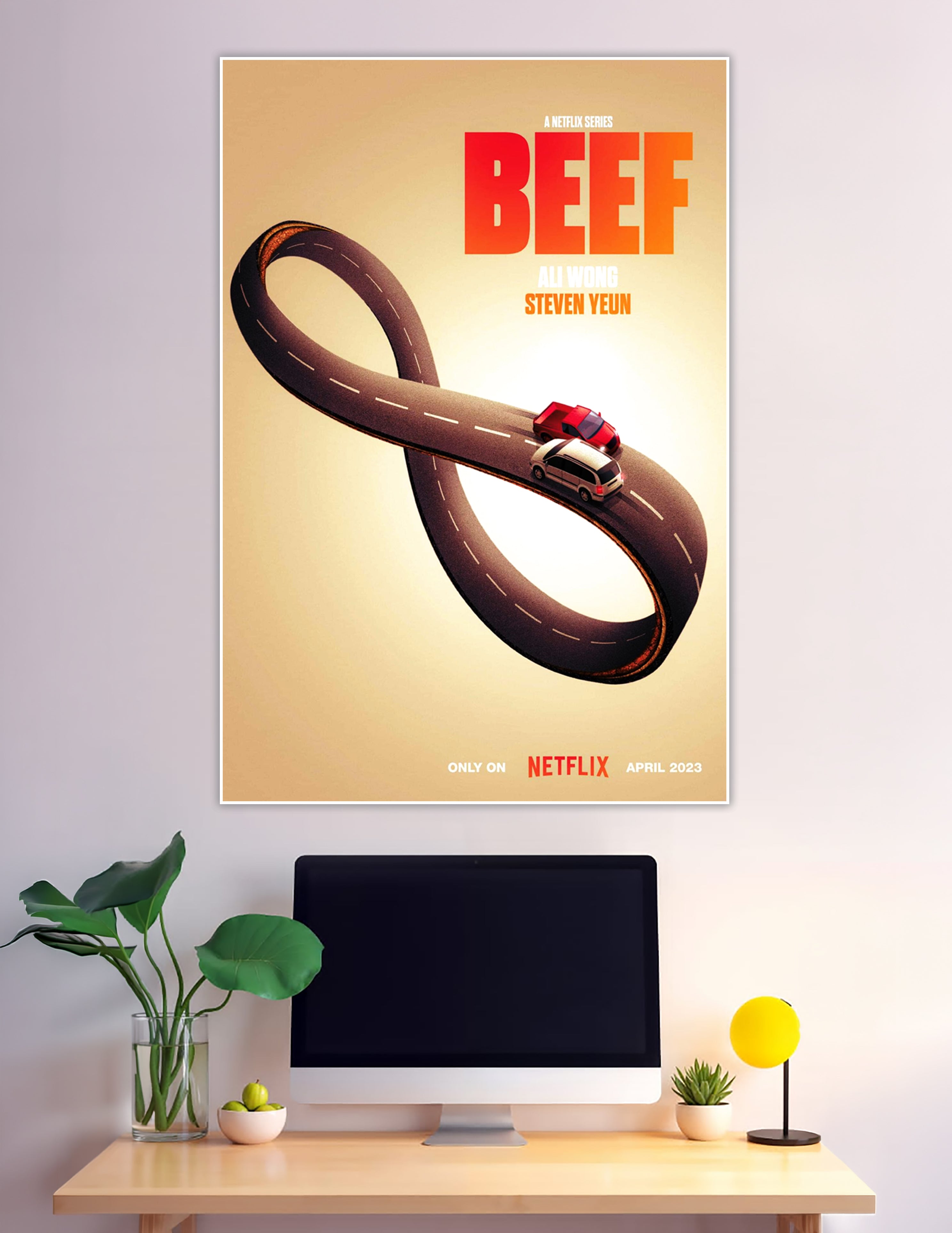 BEEF Netflix series promotional poster showing two cars on an infinity-shaped road with bold red title text and names Ali Wong and Steven Yeun on a warm golden background