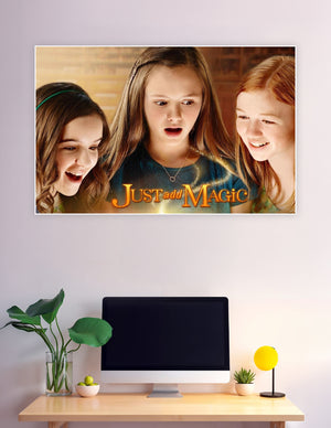 Just Add Magic Amazon Original series poster featuring three girls looking at a glowing magical cookbook with golden sparkles