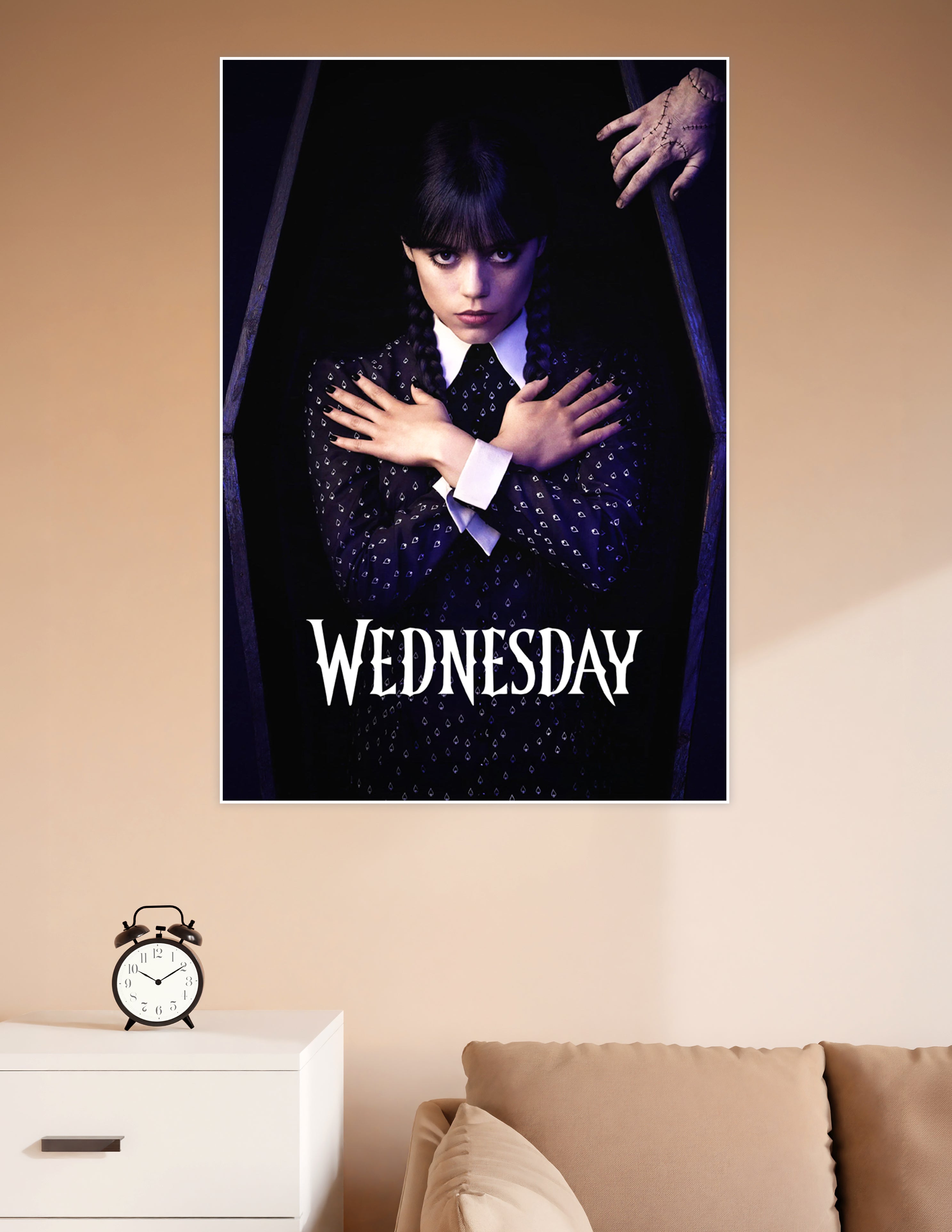 Wednesday Addams standing inside a coffin with arms crossed, wearing black dress with white collar, Thing visible above, official Netflix series poster