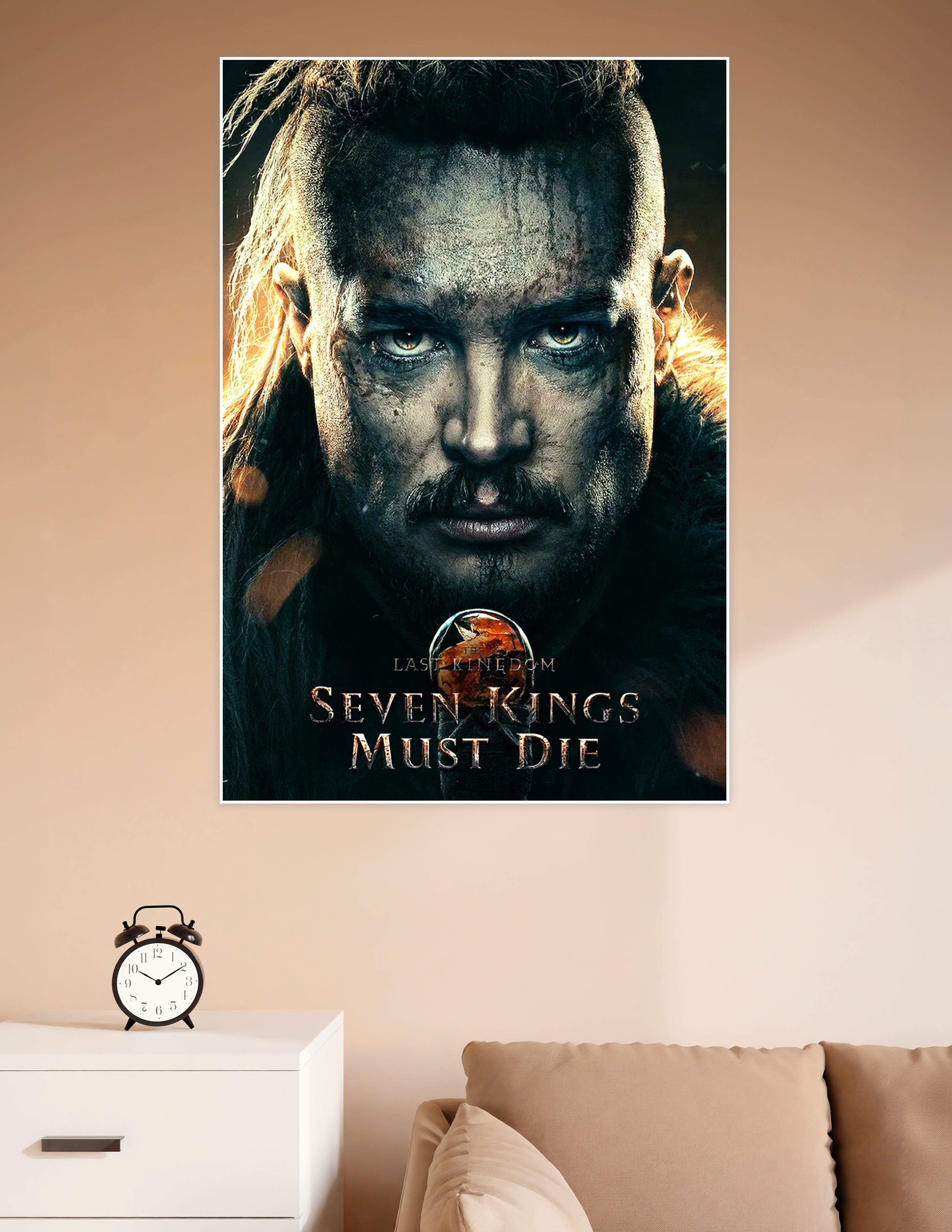 The Last Kingdom Seven Kings Must Die movie poster featuring a battle-worn Uhtred of Bebbanburg with a fierce gaze, dark war paint, and fiery background