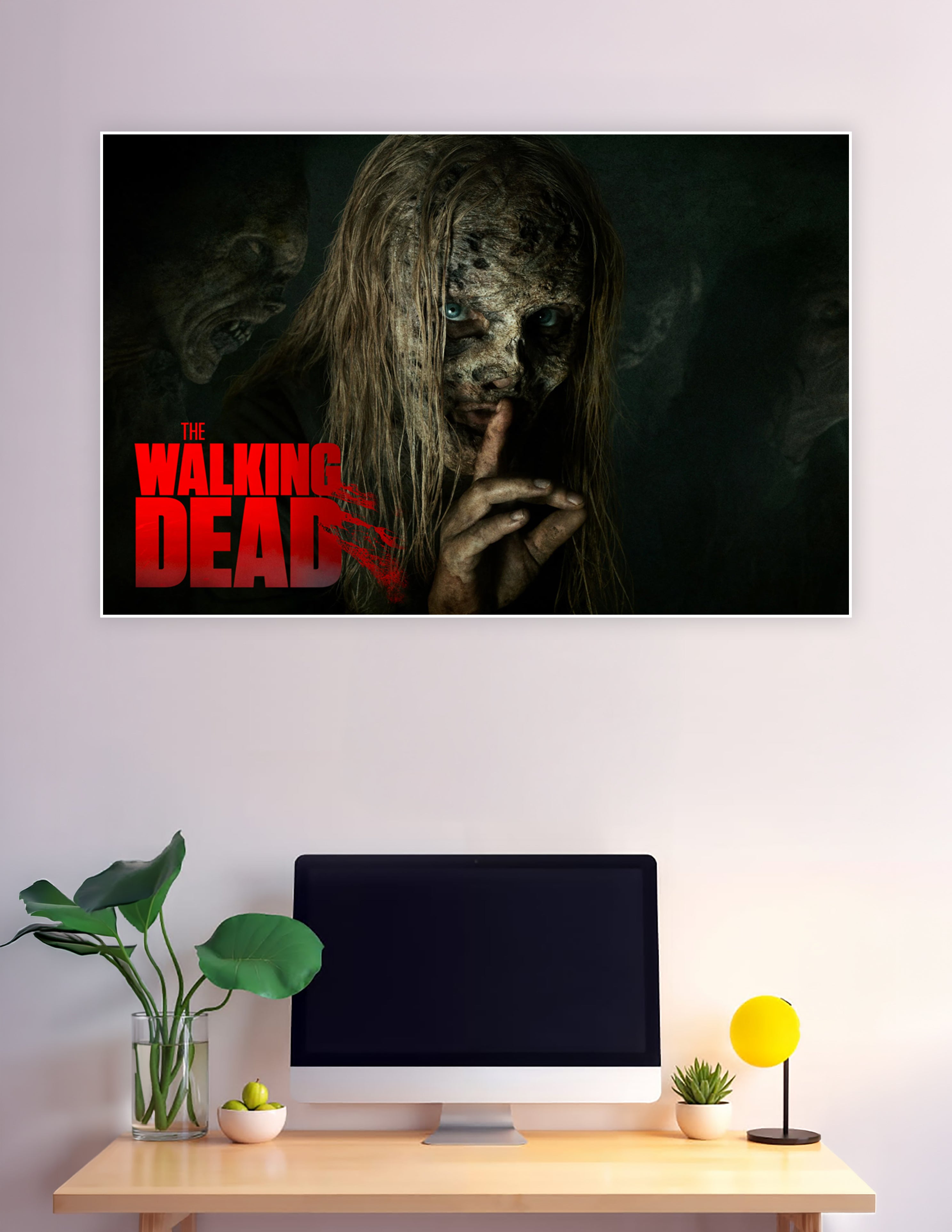 The Walking Dead poster featuring a Whisperer with decayed face and blue eyes making a silence gesture with zombies in the dark background