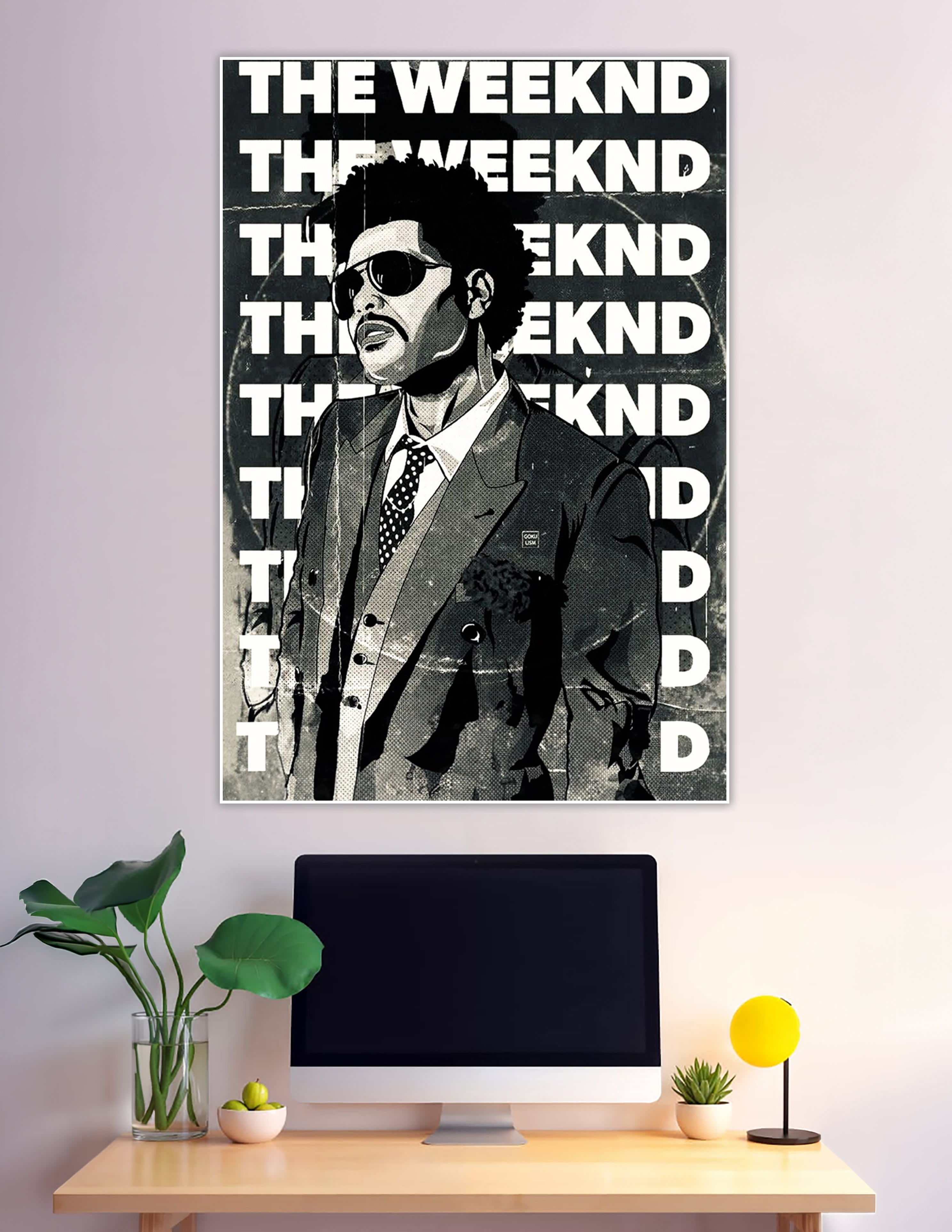 Black and white comic-style illustration poster of The Weeknd in a suit with sunglasses, surrounded by bold repeating THE WEEKND typography