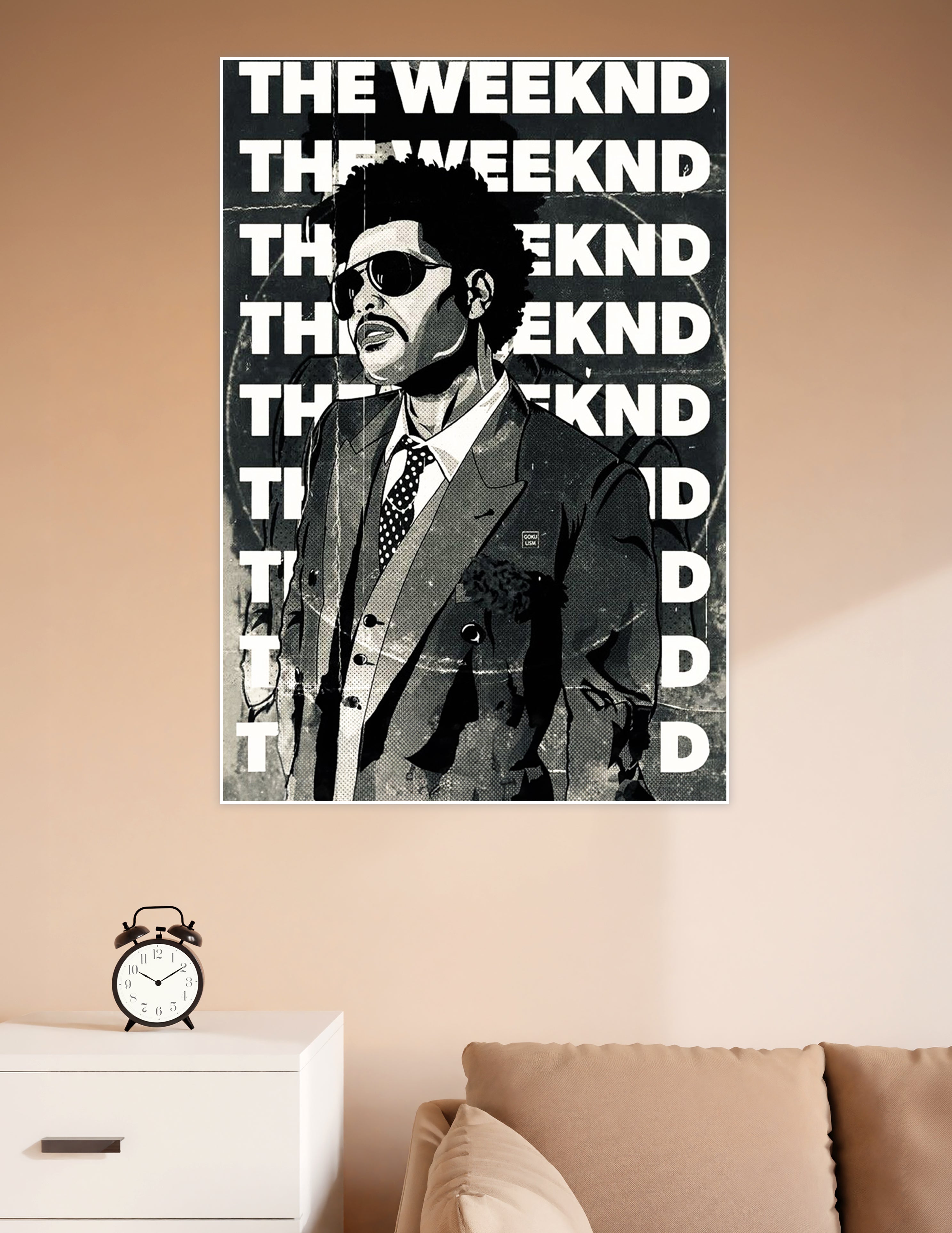 Black and white comic-style illustration poster of The Weeknd in a suit with sunglasses, surrounded by bold repeating THE WEEKND typography