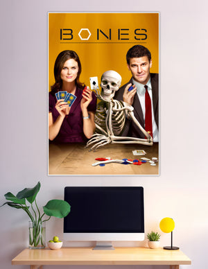 Bones TV show promotional poster featuring two cast members and a skeleton playing poker on a golden background with bold BONES title text