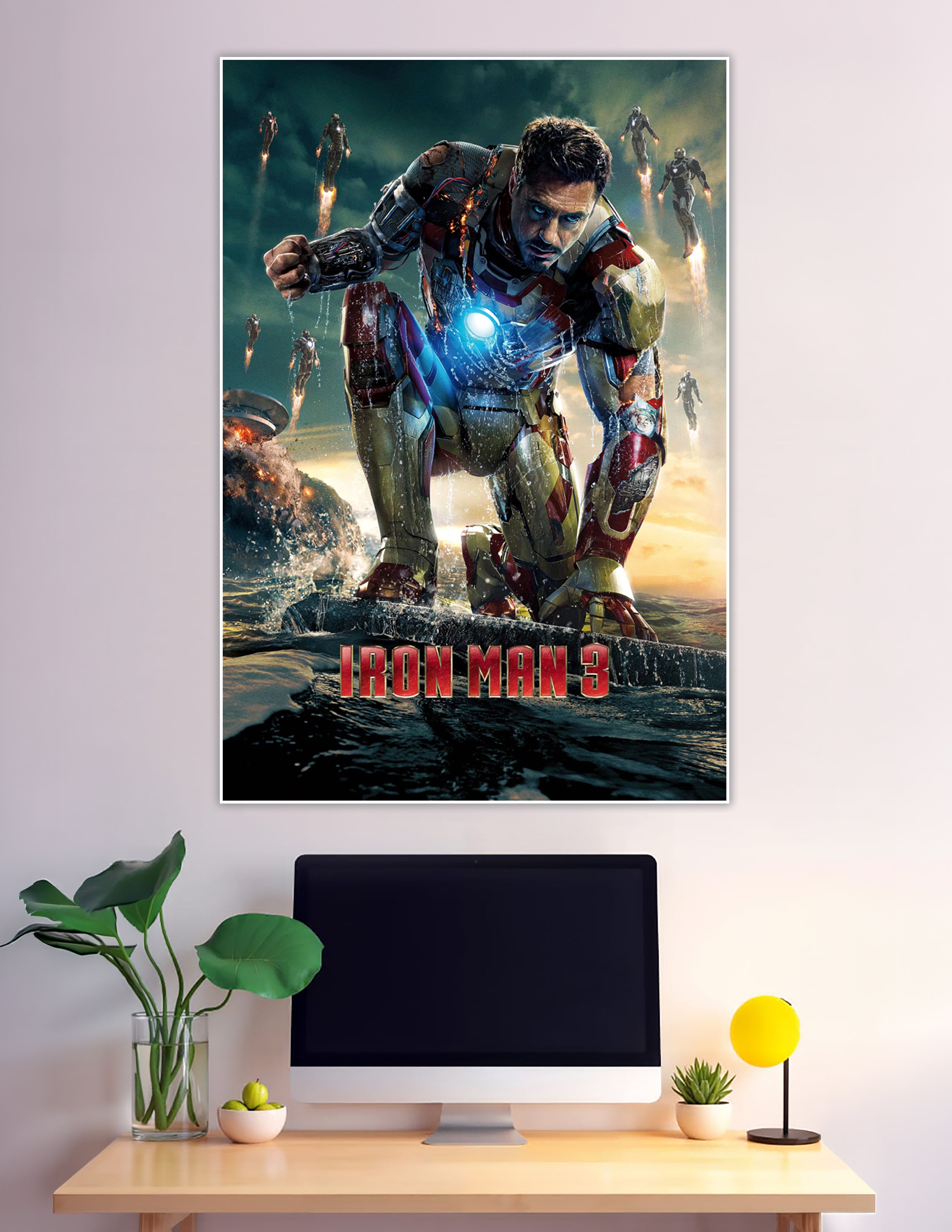 Iron Man 3 movie poster showing Tony Stark in damaged red and gold Mark XLII armor kneeling on a surface with arc reactor glowing and multiple Iron Man suits flying in the background