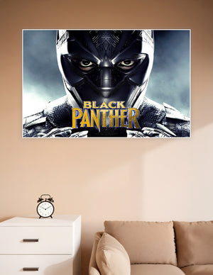 Black Panther in vibranium suit close-up movie poster with gold title text on dark stormy background