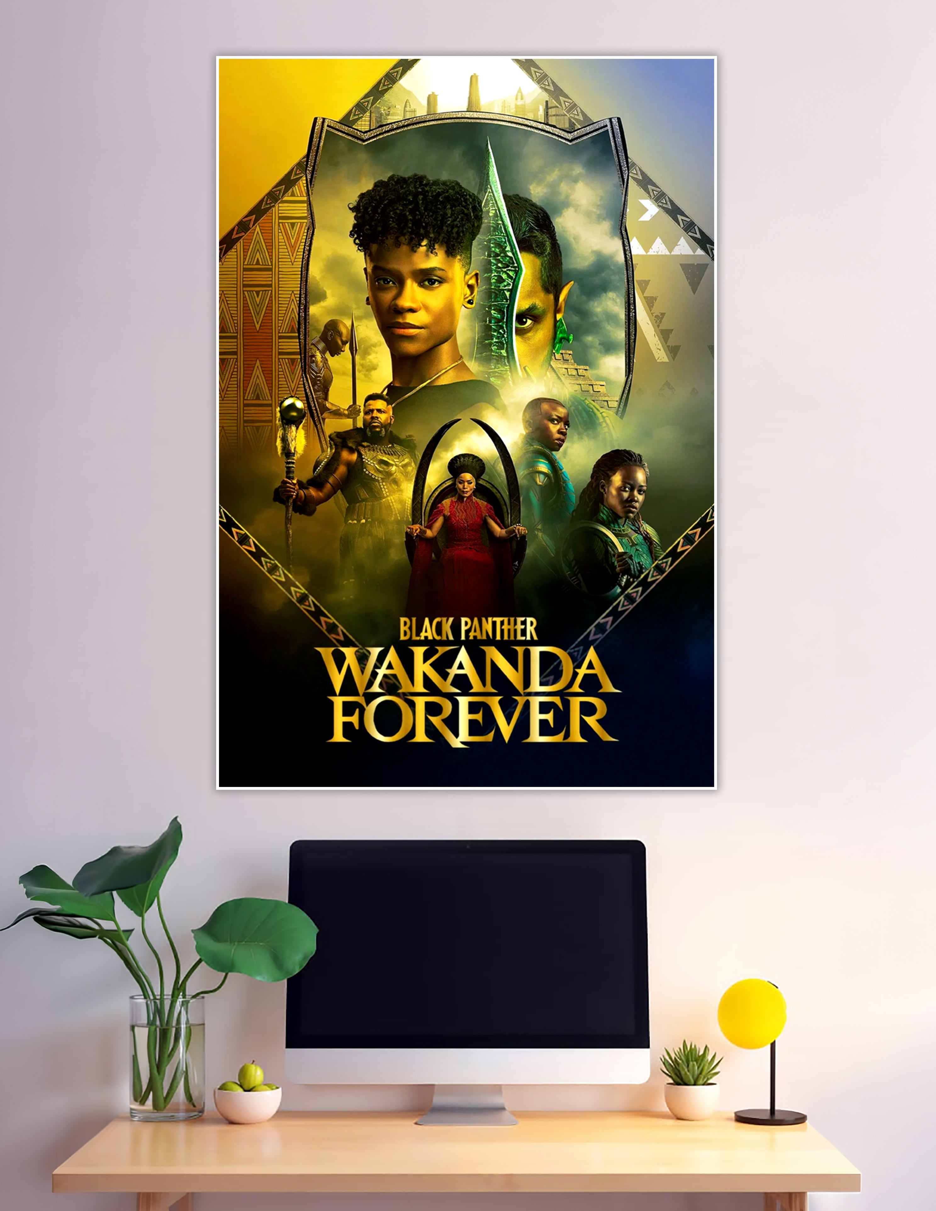 Black Panther Wakanda Forever official movie poster featuring the cast in gold and emerald tones with Wakandan tribal shield frame design