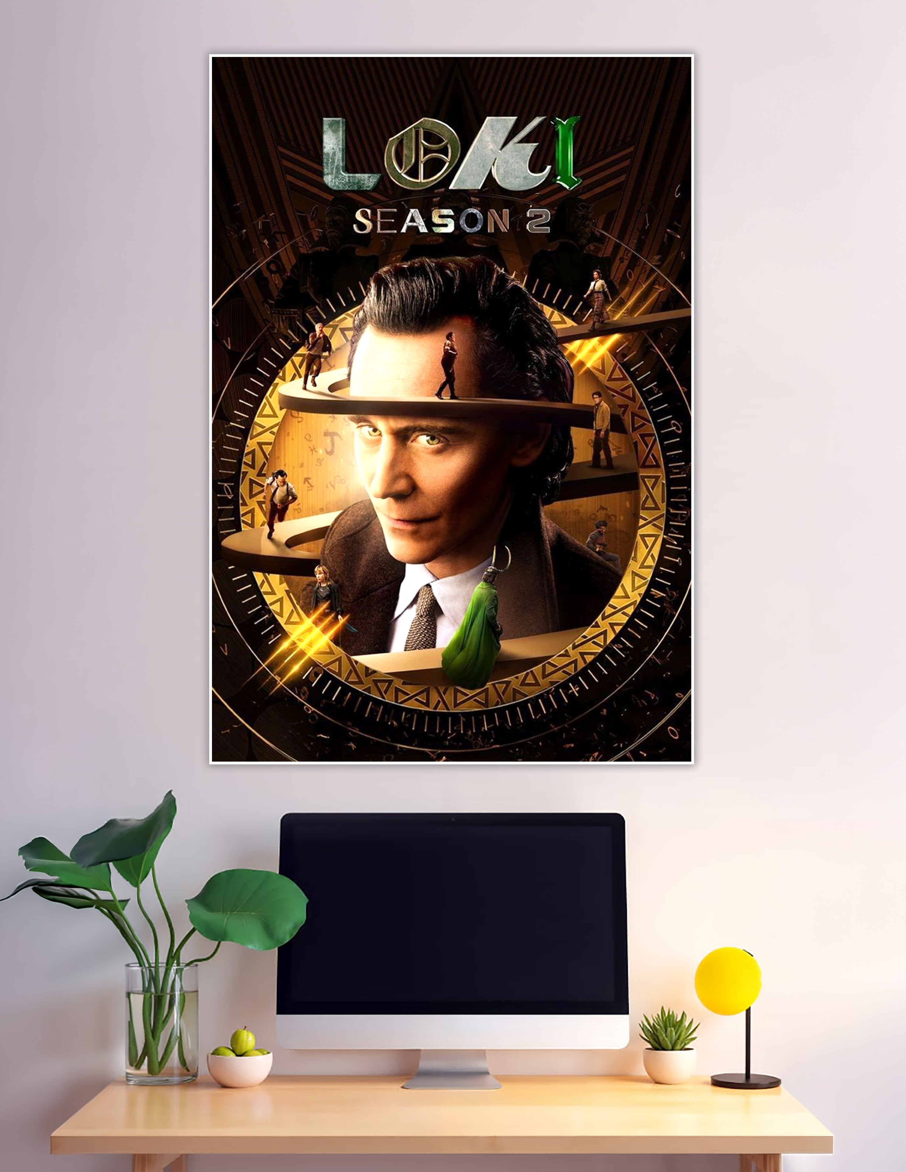 Loki Season 2 official poster featuring the God of Mischief centered in a golden time-wheel with spiraling platforms and rune markings