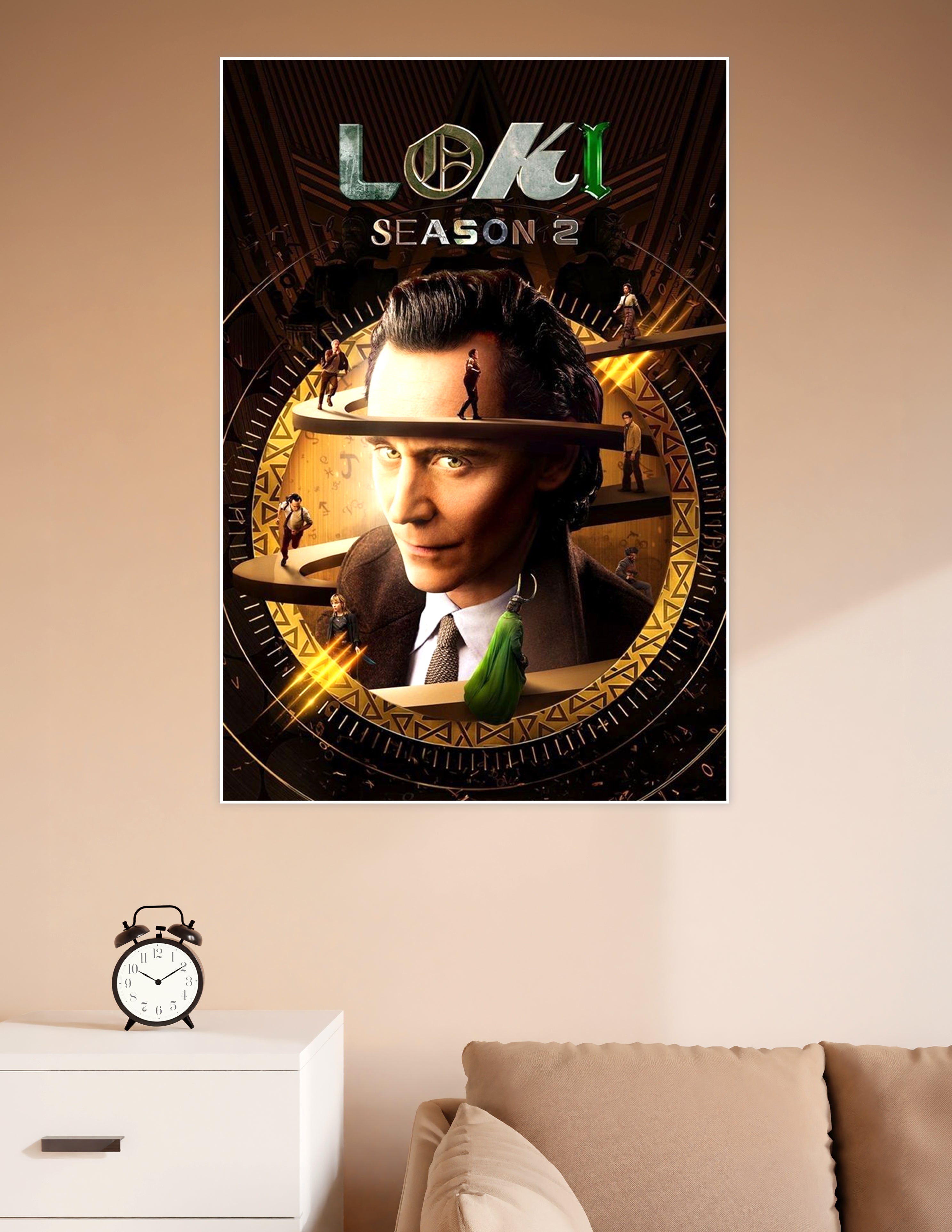 Loki Season 2 official poster featuring the God of Mischief centered in a golden time-wheel with spiraling platforms and rune markings
