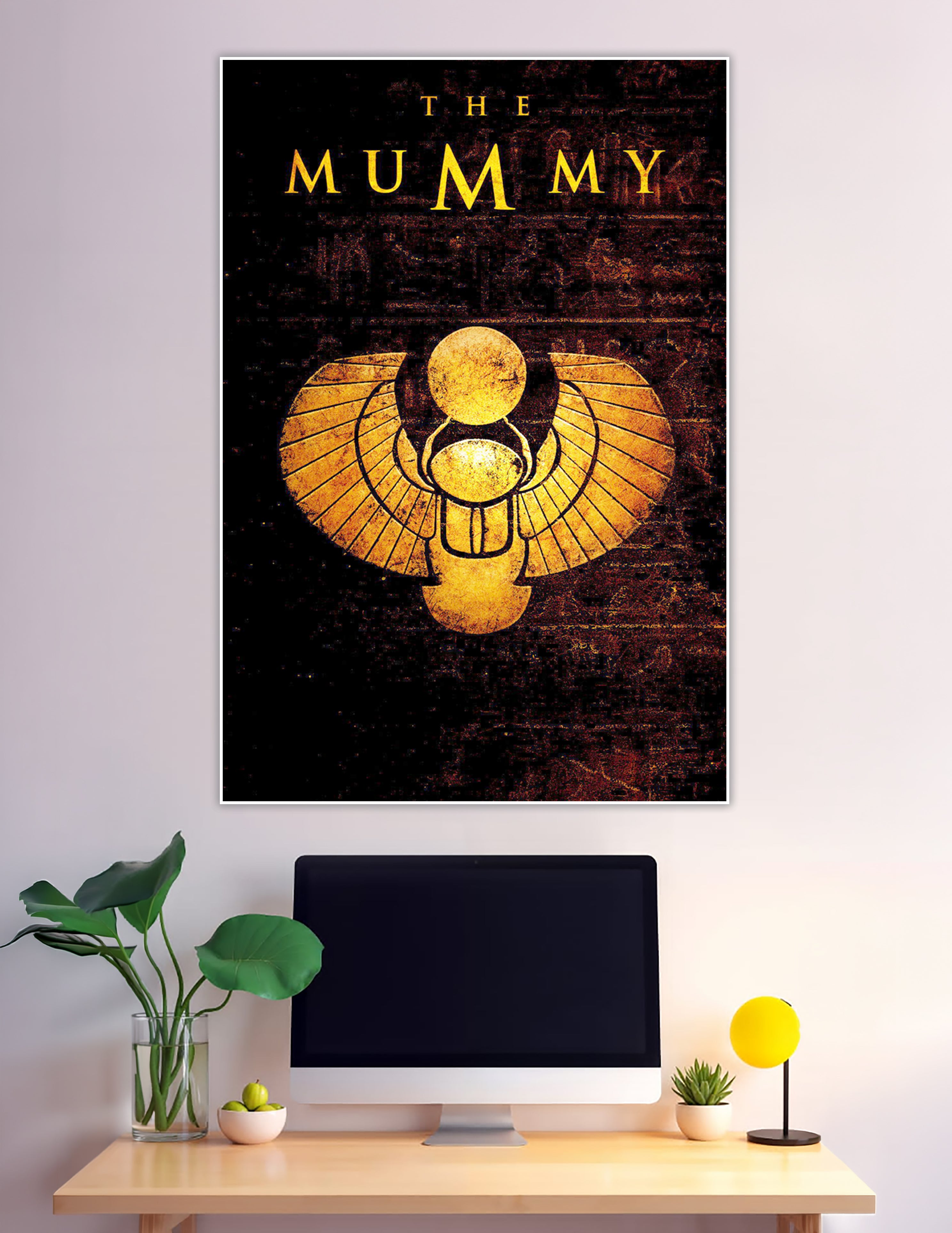 The Mummy movie poster with golden scarab beetle symbol