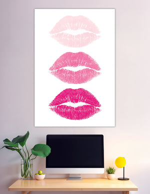 Three pink lipstick kiss prints on white background