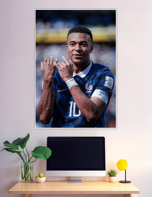France number 10 footballer celebrating in blue FFF jersey