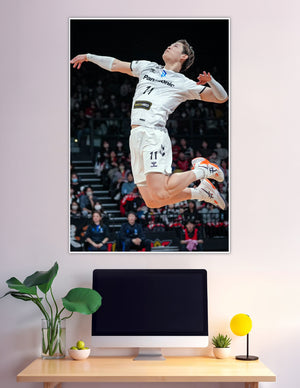 Volleyball player number 11 jumping mid-air during match