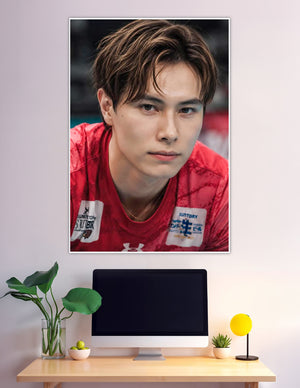 Close-up portrait of Japanese volleyball player in red Suntory jersey