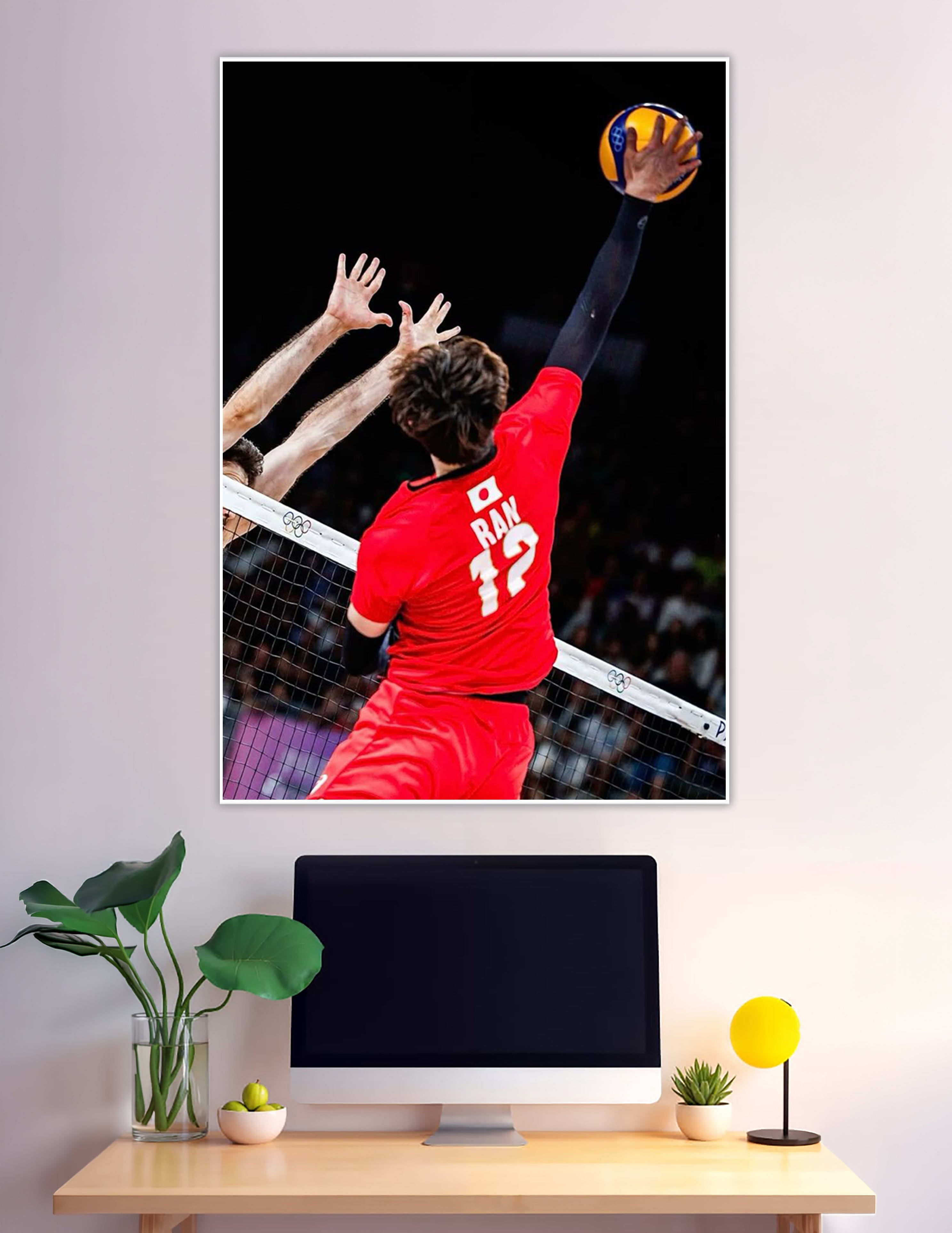 Olympic volleyball player number 12 spiking ball over net