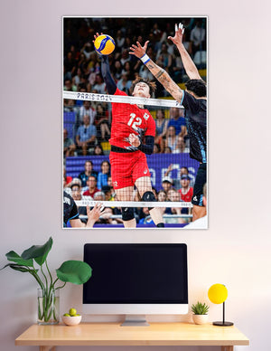 Player number 12 spiking volleyball at Paris 2024 Olympics