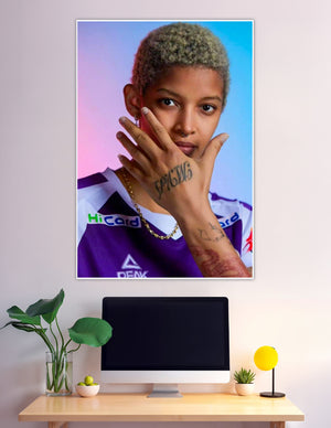 Tattooed athlete in purple jersey against gradient background