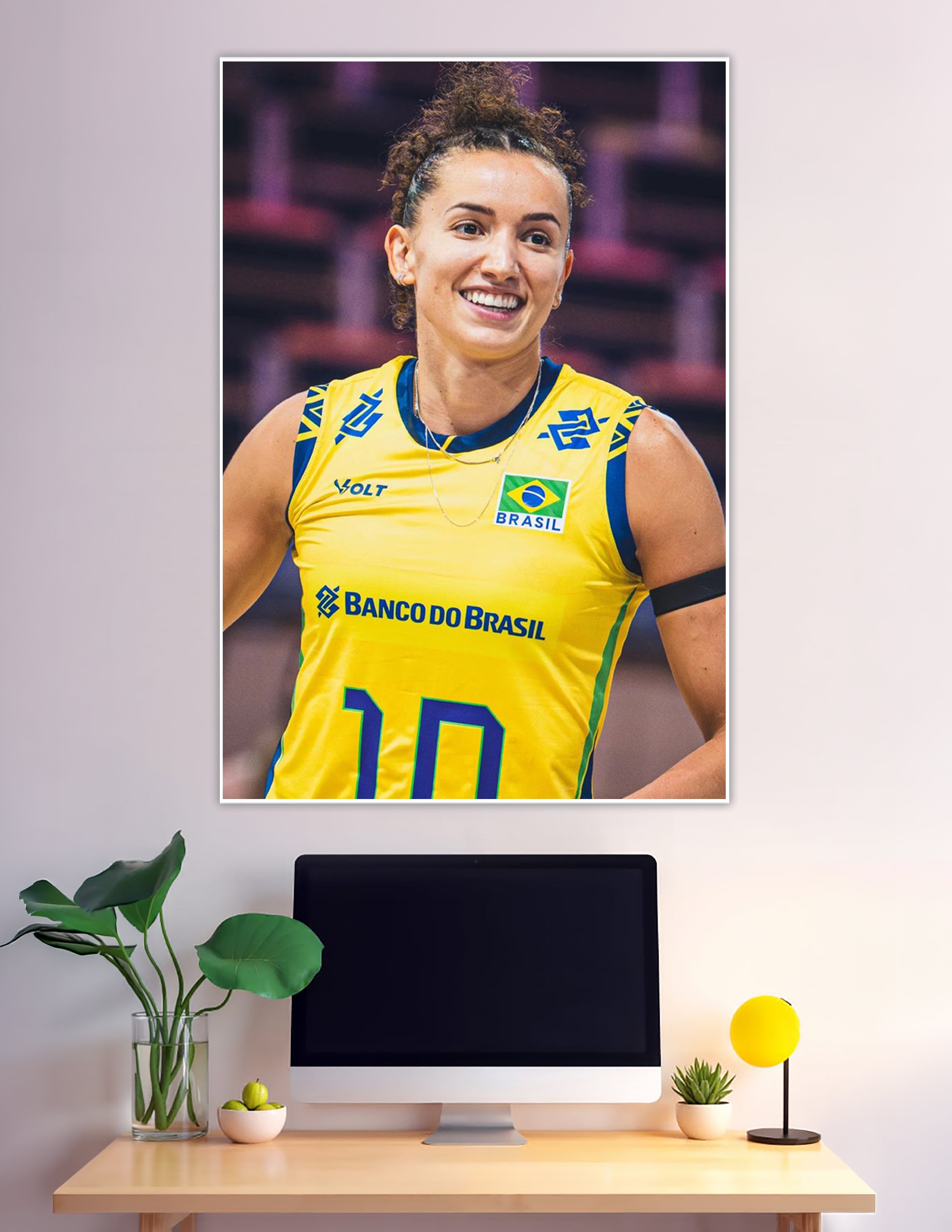 Smiling Brazil volleyball player wearing yellow Brasil jersey number 10