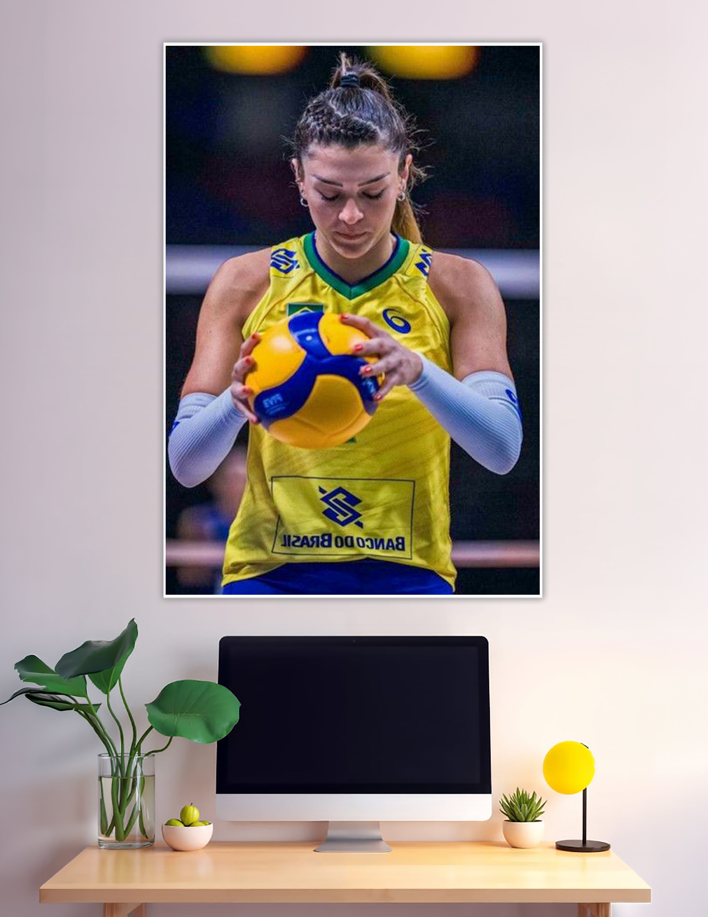 Brazilian female volleyball player holding Mikasa ball focused