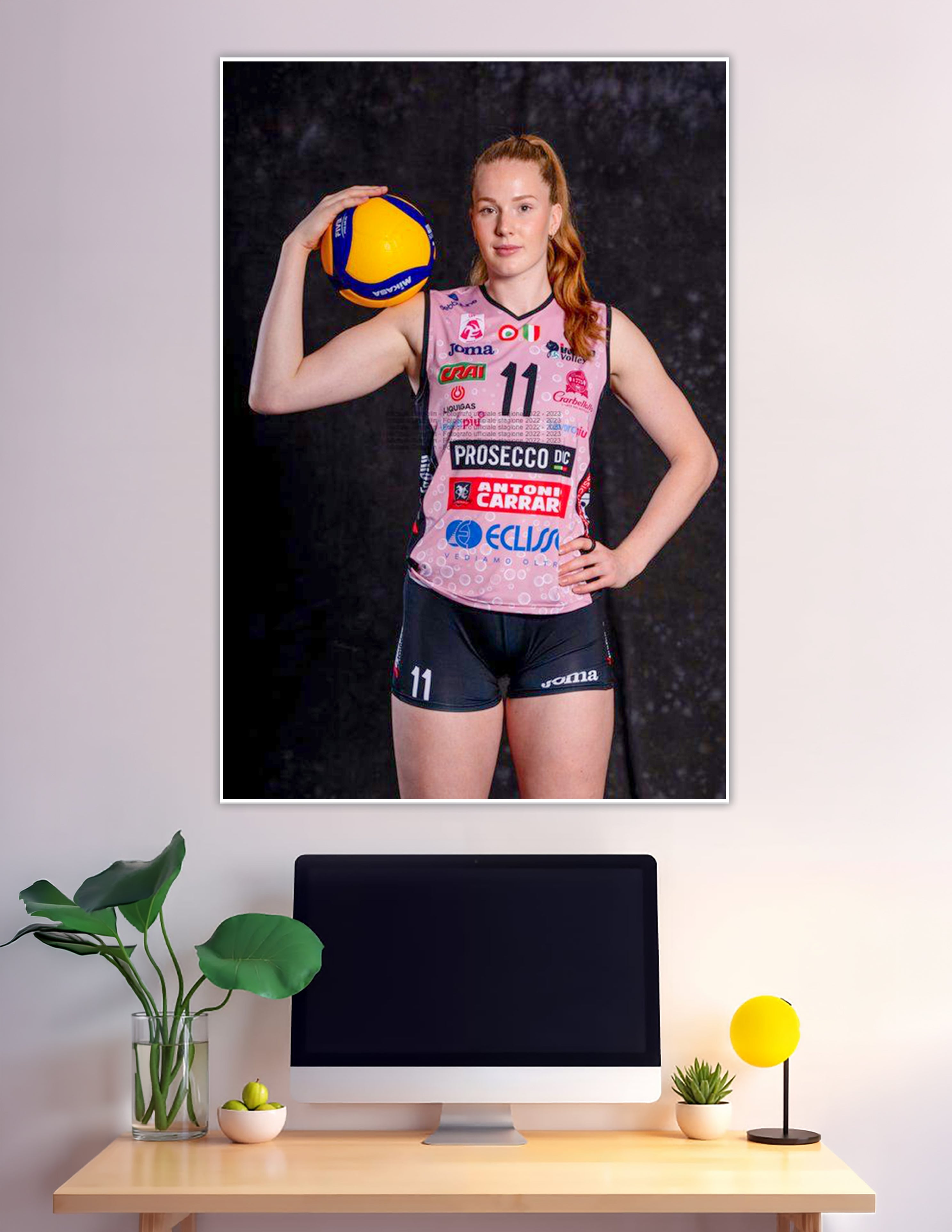 Female volleyball player number 11 pink jersey holding Mikasa ball