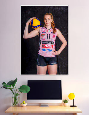 Female volleyball player number 11 pink jersey holding Mikasa ball